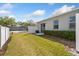 Backyard featuring lush green grass and a white fence at 819 Featherstone Ln, Lake Mary, FL 32746