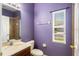 Bathroom features a window, toilet and single sink at 819 Featherstone Ln, Lake Mary, FL 32746