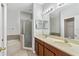 A spacious bathroom boasts double sinks, a soaking tub, and a separate glass-enclosed shower at 819 Featherstone Ln, Lake Mary, FL 32746