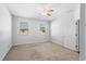 Bright and airy bedroom with neutral carpet, ceiling fan, and natural light at 819 Featherstone Ln, Lake Mary, FL 32746