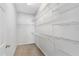 A walk-in closet provides ample storage with wire shelving at 819 Featherstone Ln, Lake Mary, FL 32746
