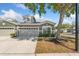 Charming one-story home with gray exterior, landscaped front yard, and two-car garage at 819 Featherstone Ln, Lake Mary, FL 32746