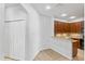 Partial view of a functional kitchen with bar seating and dark wood cabinets at 819 Featherstone Ln, Lake Mary, FL 32746