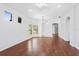 Open-concept living room with hardwood floors and plenty of natural light at 819 Featherstone Ln, Lake Mary, FL 32746