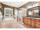 A bathroom featuring a luxurious soaking tub, glass shower, and vanity with granite countertop at 859 Windcrest Pl, Winter Springs, FL 32708
