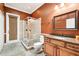 Well lit bathroom features a granite countertop, walk in shower and tile floors at 859 Windcrest Pl, Winter Springs, FL 32708