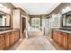Large bathroom with dual vanities, a soaking tub, a separate shower, and natural light at 859 Windcrest Pl, Winter Springs, FL 32708