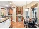Cozy breakfast nook with a wine fridge and custom cabinets, bathed in natural light at 859 Windcrest Pl, Winter Springs, FL 32708