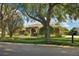Charming single-story home with well-manicured front yard and mature shade trees at 859 Windcrest Pl, Winter Springs, FL 32708