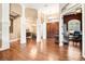 Elegant foyer with high ceilings, hardwood floors, and ornate architectural details at 859 Windcrest Pl, Winter Springs, FL 32708