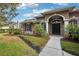 Charming home featuring manicured landscaping and a welcoming entrance way at 859 Windcrest Pl, Winter Springs, FL 32708