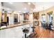 Kitchen area featuring bar seating, dark wood cabinets, granite countertops, and stainless steel appliances at 859 Windcrest Pl, Winter Springs, FL 32708