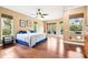 Bright main bedroom with hardwood floors, plenty of natural light and a ceiling fan at 859 Windcrest Pl, Winter Springs, FL 32708