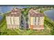 Aerial shot of waterfront community, showcasing building exteriors and parking at 8743 S The Esplanade # 18, Orlando, FL 32836