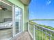 Balcony view of waterfront with sliding glass doors to bedroom and view of lake at 8743 S The Esplanade # 18, Orlando, FL 32836