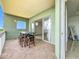 View of the balcony shows the sliding glass door from outside at 8743 S The Esplanade # 18, Orlando, FL 32836