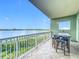 Covered balcony offers serene waterfront views and seating at 8743 S The Esplanade # 18, Orlando, FL 32836