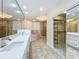 This modern bathroom features a dual sink vanity, soaking tub, and glass shower at 8743 S The Esplanade # 18, Orlando, FL 32836