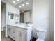 Bathroom featuring double vanity with a full mirror and adjacent toilet at 8743 S The Esplanade # 18, Orlando, FL 32836