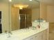 Bathroom featuring double sinks and a large mirror at 8743 S The Esplanade # 18, Orlando, FL 32836