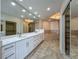 This luxury bathroom features a dual sink vanity, soaking tub, and walk-in shower at 8743 S The Esplanade # 18, Orlando, FL 32836