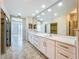 This bathroom features a dual sink vanity with a large mirror and plenty of storage at 8743 S The Esplanade # 18, Orlando, FL 32836