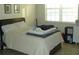 Bright bedroom with a comfortable bed and window at 8743 S The Esplanade # 18, Orlando, FL 32836