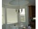Cozy dining nook with a chandelier and natural light at 8743 S The Esplanade # 18, Orlando, FL 32836