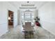 Dining room featuring modern chandelier, bright windows and view to the kitchen at 8743 S The Esplanade # 18, Orlando, FL 32836