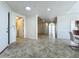 Welcoming foyer with tile flooring, arched doorways, and views into the laundry and living areas at 8743 S The Esplanade # 18, Orlando, FL 32836