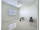 Empty gym space with a ceiling fan and an adjustable bench at 8743 S The Esplanade # 18, Orlando, FL 32836