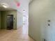 Clean, well-lit hallway with an elevator and numbered apartment door at 8743 S The Esplanade # 18, Orlando, FL 32836