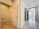 Hallway featuring access to bathroom, walk-in closet and bedroom with beautiful views at 8743 S The Esplanade # 18, Orlando, FL 32836