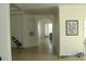 Spacious hallway with arched doorways and neutral tile flooring at 8743 S The Esplanade # 18, Orlando, FL 32836