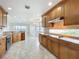 Spacious kitchen featuring granite countertops, tile backsplash, and stainless steel appliances at 8743 S The Esplanade # 18, Orlando, FL 32836