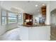 Open kitchen with granite countertops, stainless appliances, and a breakfast nook by a window at 8743 S The Esplanade # 18, Orlando, FL 32836