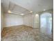 Spacious living area featuring a tray ceiling, neutral color palette and tile flooring at 8743 S The Esplanade # 18, Orlando, FL 32836