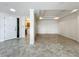 Open floor plan living area featuring a tray ceiling and tile flooring at 8743 S The Esplanade # 18, Orlando, FL 32836