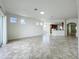 Bright living area featuring tile flooring, an open layout and sliding glass doors at 8743 S The Esplanade # 18, Orlando, FL 32836