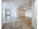 Spacious living room featuring an open floor plan, neutral paint, tile flooring, and recessed lighting at 8743 S The Esplanade # 18, Orlando, FL 32836