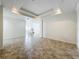Spacious living area featuring recessed lights, tile floors and an open view into the formal dining room at 8743 S The Esplanade # 18, Orlando, FL 32836