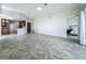 Spacious open floor plan with tile floors connecting the living area to the kitchen and bedroom at 8743 S The Esplanade # 18, Orlando, FL 32836