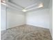Expansive living room showcasing crown molding, recessed lighting, and tile floors for a clean and modern aesthetic at 8743 S The Esplanade # 18, Orlando, FL 32836