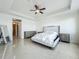 Primary bedroom offers plenty of space, natural light, and a door that leads to another room at 8743 S The Esplanade # 18, Orlando, FL 32836