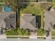 Aerial view displays the home's roof, backyard, and surrounding landscaping, offering a sense of the property's layout at 920 Nola Dr, Ocoee, FL 34761
