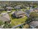 This aerial view highlights the home's position within a neighborhood with manicured lawns and mature trees at 920 Nola Dr, Ocoee, FL 34761