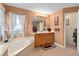 Serene bathroom featuring a soaking tub, vanity with decorative accents, and abundant natural light at 920 Nola Dr, Ocoee, FL 34761