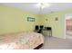 Bedroom with an office space including a desk with computers and monitors at 920 Nola Dr, Ocoee, FL 34761
