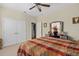 Spacious bedroom featuring a plush bed, dresser, and neutral walls at 920 Nola Dr, Ocoee, FL 34761