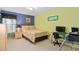 Bright bedroom with a modern desk, and light-colored walls at 920 Nola Dr, Ocoee, FL 34761